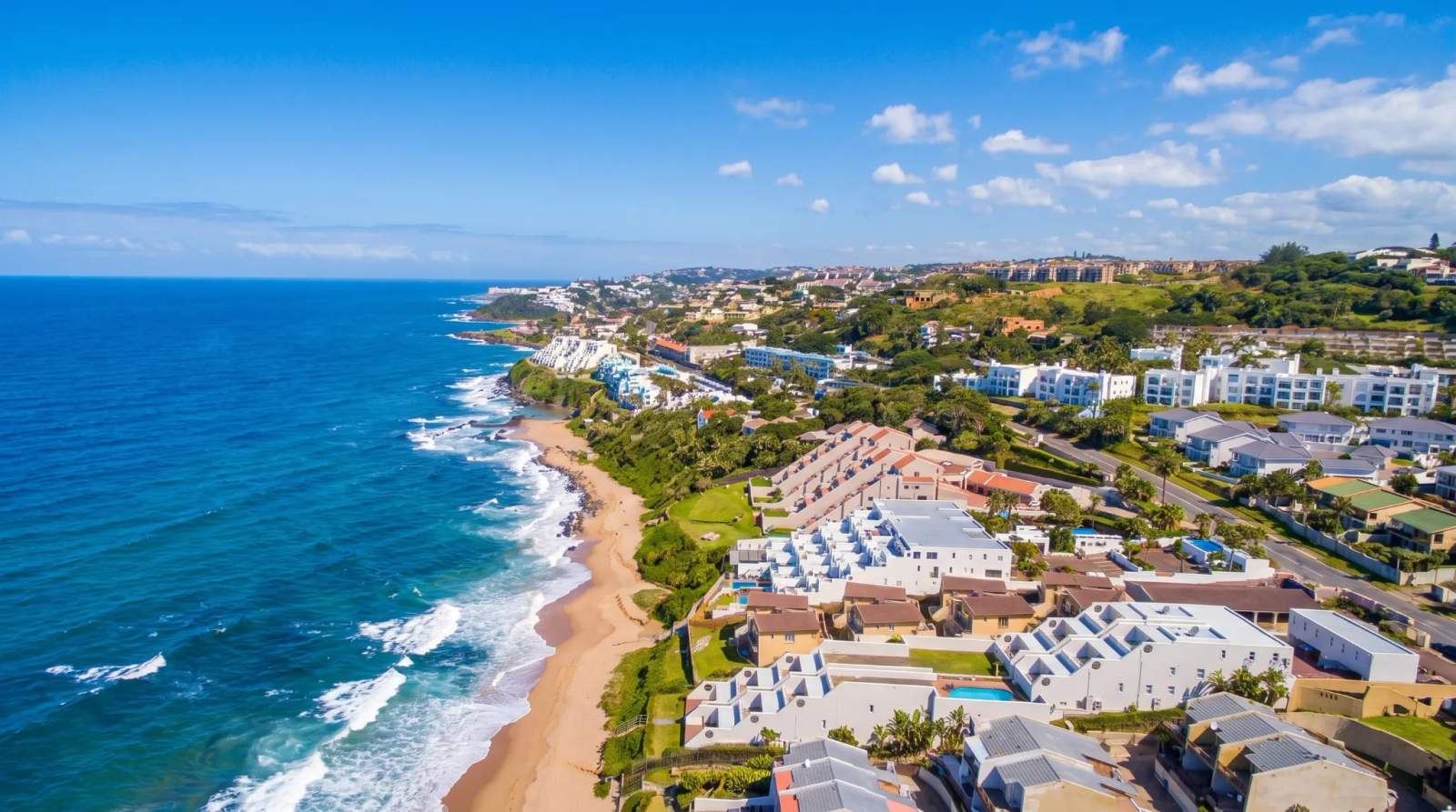 Coastal homes and resorts line the beach on the beautiful shoreline in Ballito.